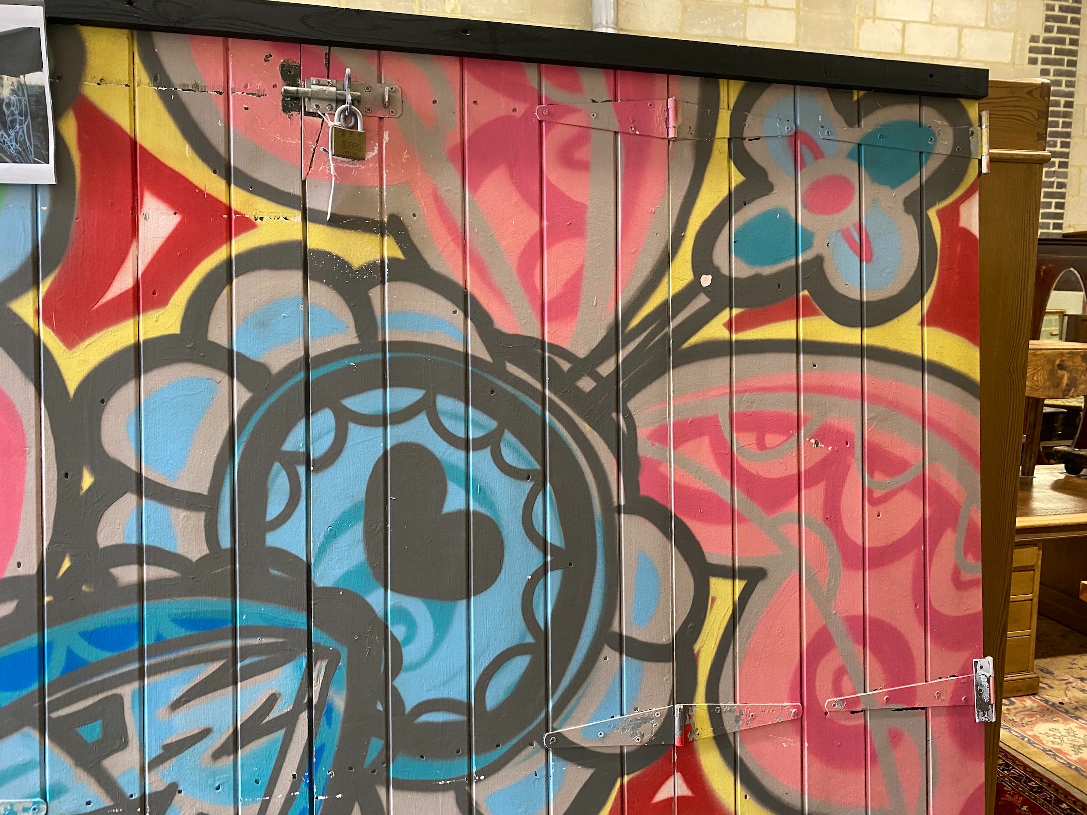 A wooden door from Camden Market with painted graffiti art width 216cm, height 207cm